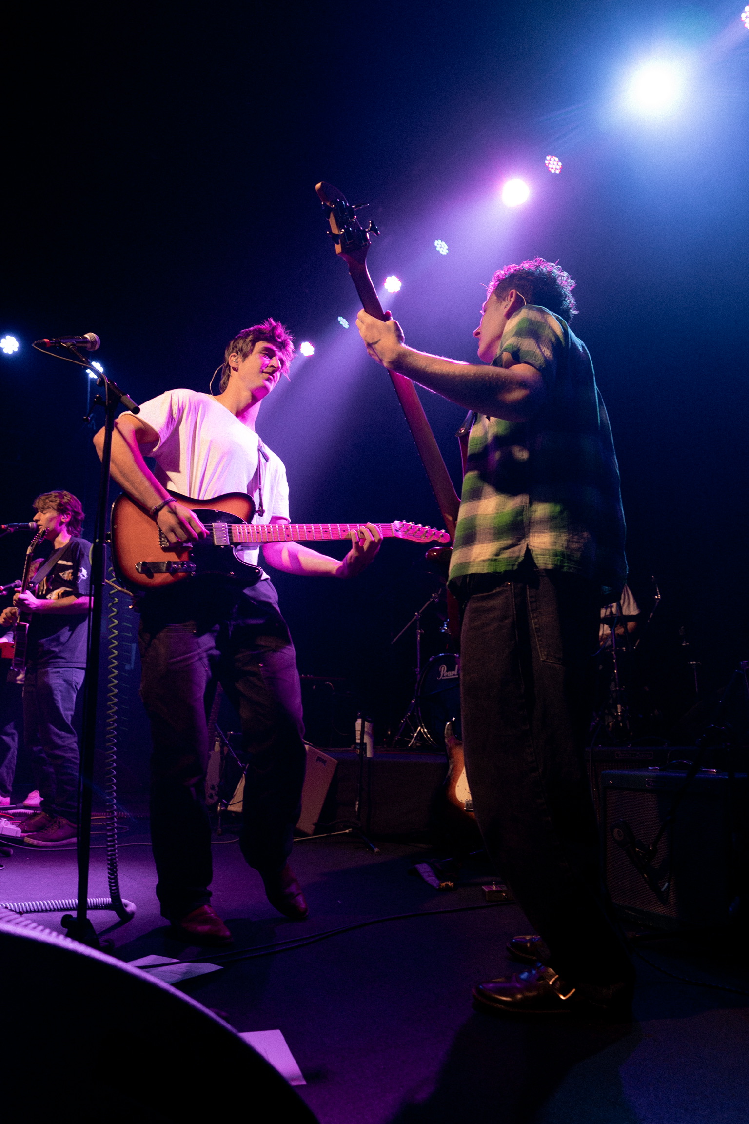 Squash band captured mid-song at Fox Theatre Boulder with colorful stage lighting