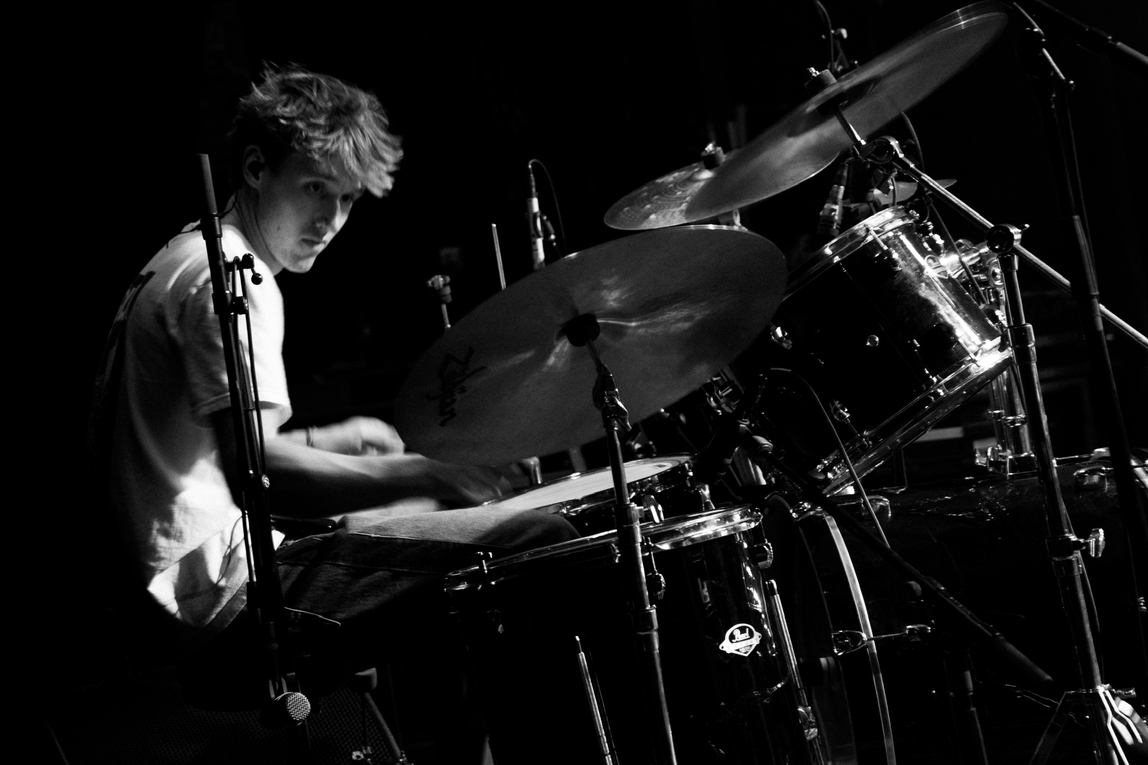 Lead guitarist from Squash playing under dramatic lighting at Fox Theatre Boulder