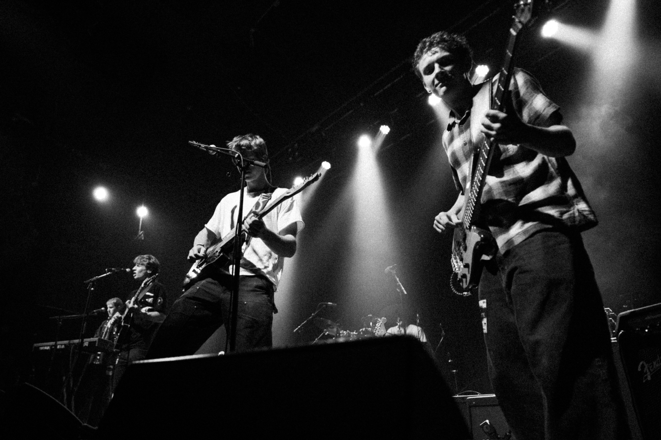 Guitarist and bassist from Squash sharing vocals at Fox Theatre performance