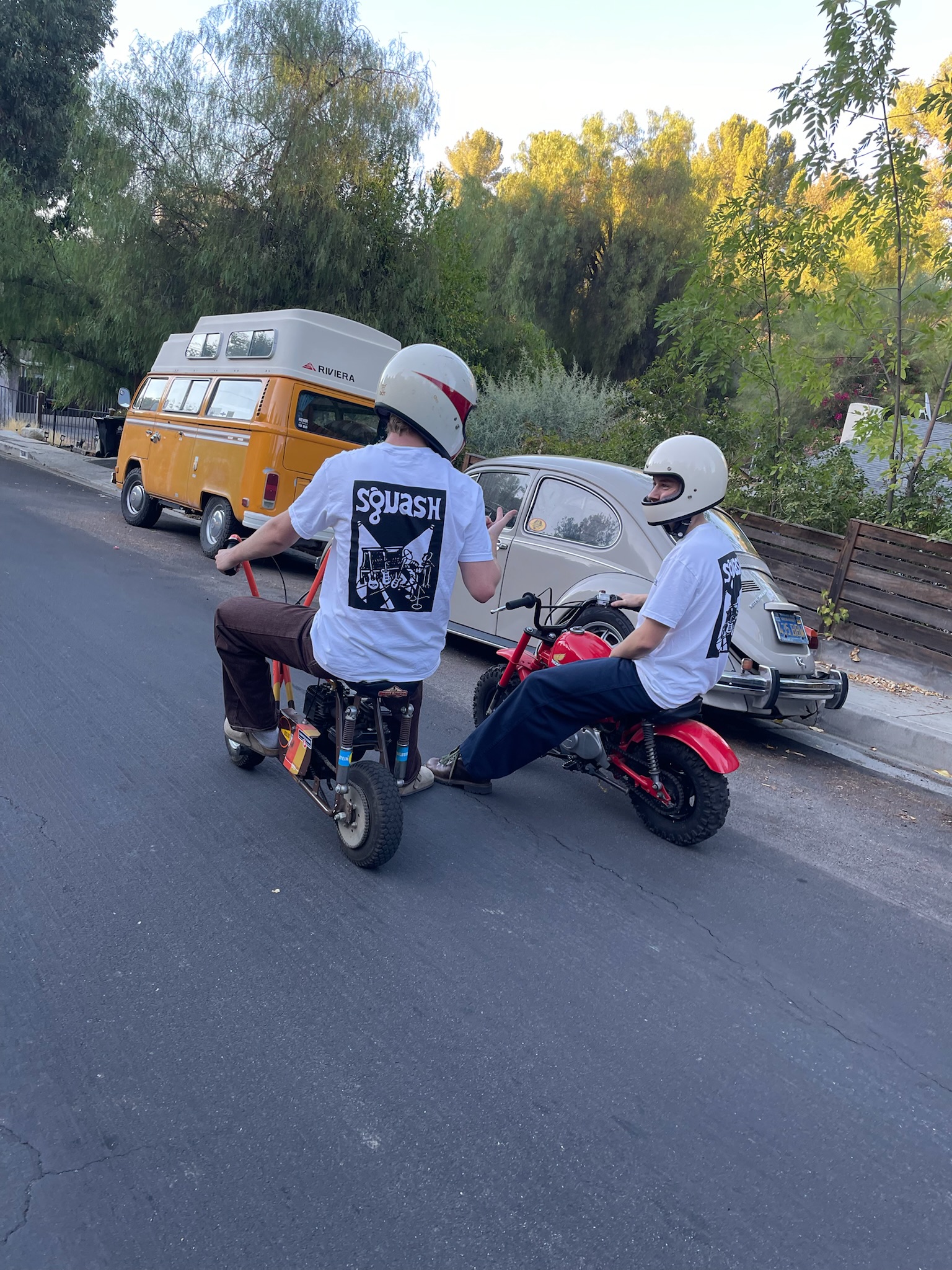 Squash band merchandise and minibike setup during Boulder house show